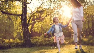 Mother and Daughter Skipping