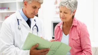 Woman reviewing her imaging test with her doctor