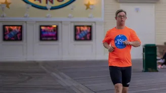 Chris Nikic running at Disney's Boardwalk Resort.