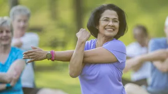 Woman stretching in a park