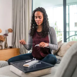Black woman taking at home COVID-19 test