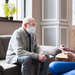 A Patient Speaks with a Provider in the Lobby of a Medical Practice. 