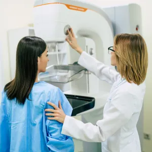 A Provider Prepares a Patient for Her Mammogram.
