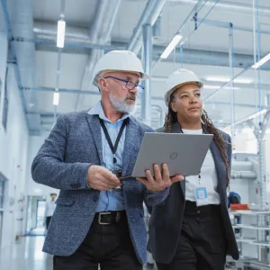 Two Supervisors Inspect a Factory Floor