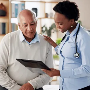 A Doctor Goes Over a Chart with a Patient