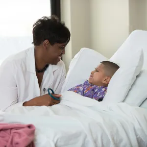 Doctor checking on Child.