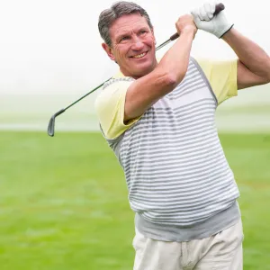 A couple enjoys a game of golf.