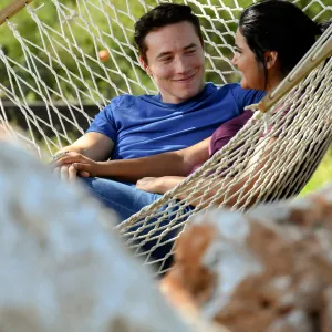 A relaxing afternoon with her husband in their hammock.