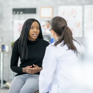 Millennial woman with primary care doctor