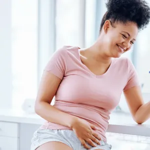 A woman seeing the happy results of her pregnancy test