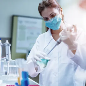  Masked Physician in lab working 