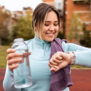 Woman Checking her time after a run
