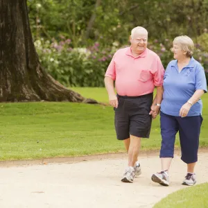 A senior couple walking outdoors