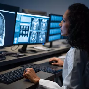 Doctor looking at a brain CT scan.