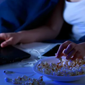 Person eating popcorn