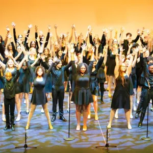 A group of people performing on stage.