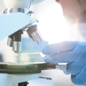Lab worker using medical equipment