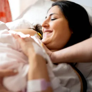 Mom giving birth in the hospital.