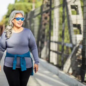 A woman exercising outside.