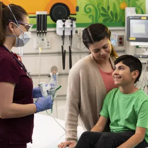 A young boy in a pediatric visit with his mother.