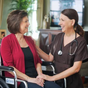 home health nurse with patient