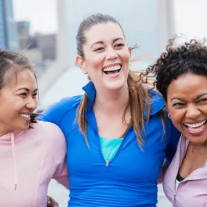 Three smiling female friends