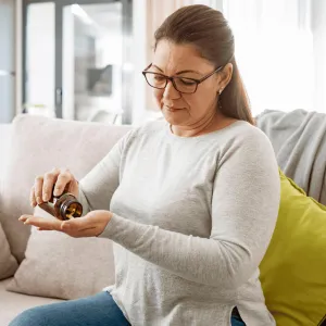 A woman taking her medication.