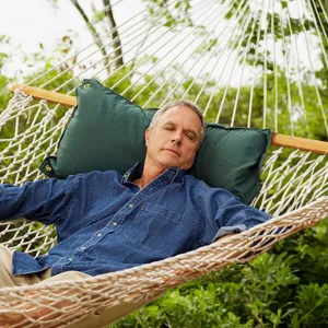 man-resting-in-a-hammock
