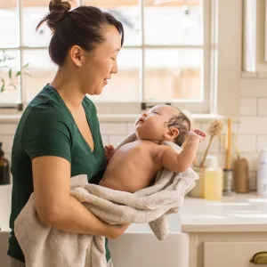 New Mom gives baby a bath