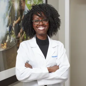 Dr. Rachel Harris, cardiologist stands and smiles
