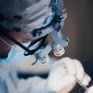 A surgeon performing reconstructive surgery.