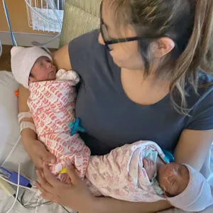 A mother holding her newborn child