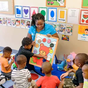 Teacher with students.