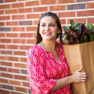 Woman taking in her groceries.