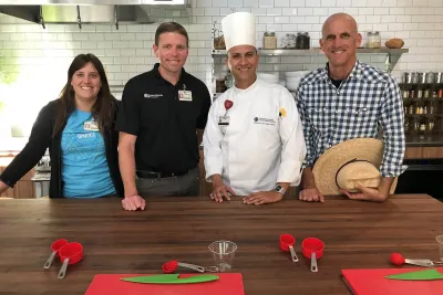 A group of AH employees in a kitchen.