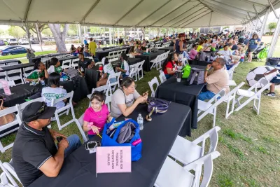 People under a banquet tent at the 2025 transplant reunion picnic