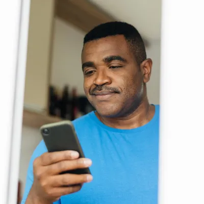 Man reading iPhone 