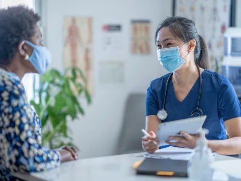 A Doctor Discusses with Her Patient Options for Her Health Care.