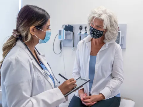 A female patient listening to her female physician.