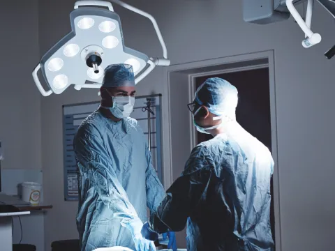 Two Surgeons Prepare the Operating Room for a Procedure.