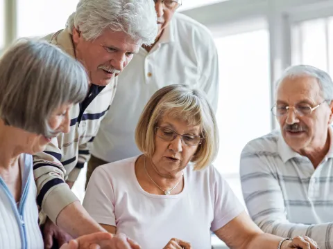 A group of seniors reading together