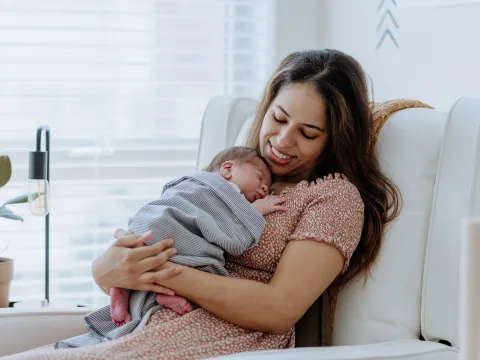 A New Mother Holds Her Baby While They Sleep.