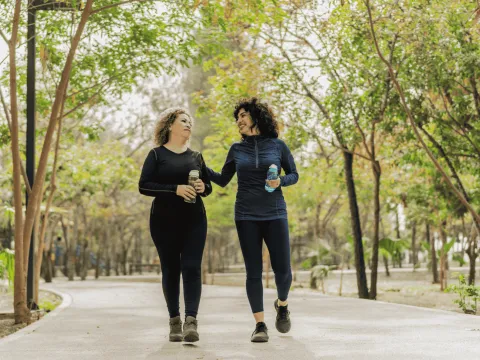 Two woman walking together