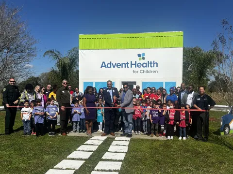 AdventHealth for Children and students from Arbor Ridge School cut the ribbon on a mini "hospital" in the Children's Safety Village.