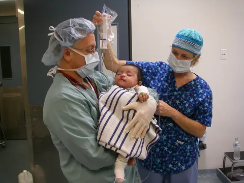 Picture of doctors taking care of a child