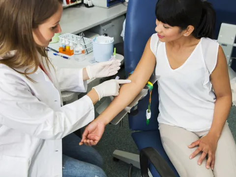 Woman prepares to have her blood drawn