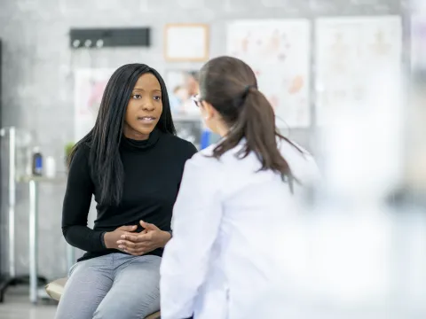 Millennial woman with primary care doctor