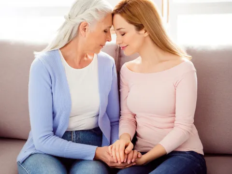Mother and Daughter Comforting Each Other