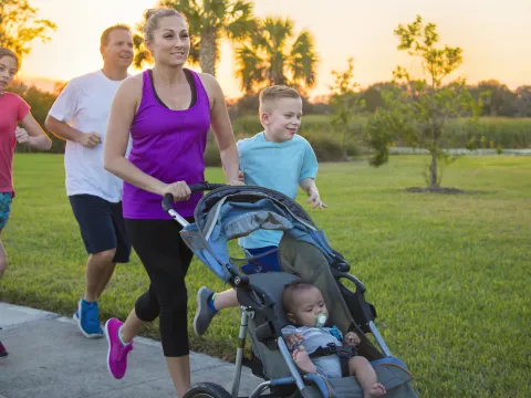 A family enjoys a run together.