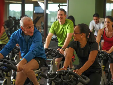Adults, young and old, doing a cycling session